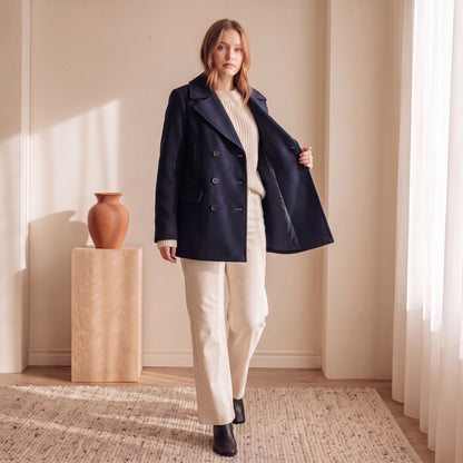 Navy double-breasted peacoat worn open over cream knit – The Lode Lane
