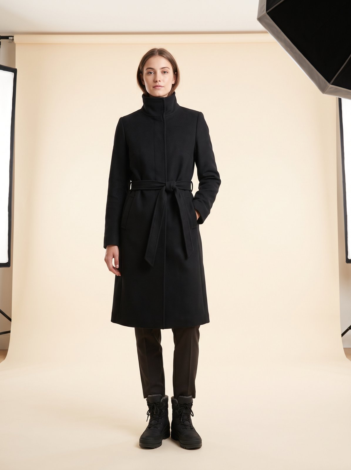 Black funnel neck belted trench coat by Lode Lane