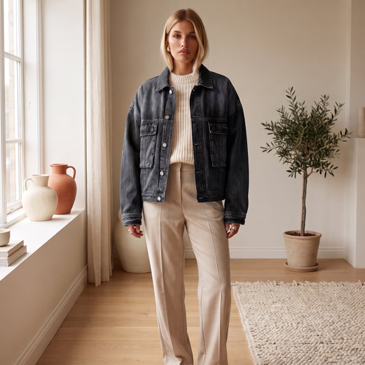 Rhea oversized black denim jacket over a cream knit by The Lode Lane