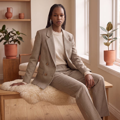 Margot brown houndstooth blazer seated by The Lode Lane