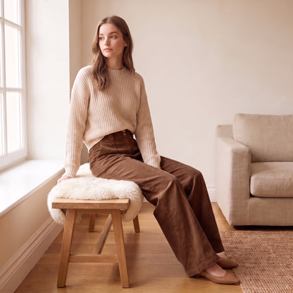 Freya chocolate wide-leg corduroy pants seated by The Lode Lane