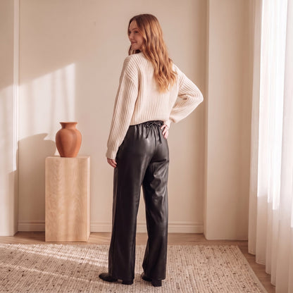 Women's black faux-leather wide-leg trousers, back view – The Lode Lane