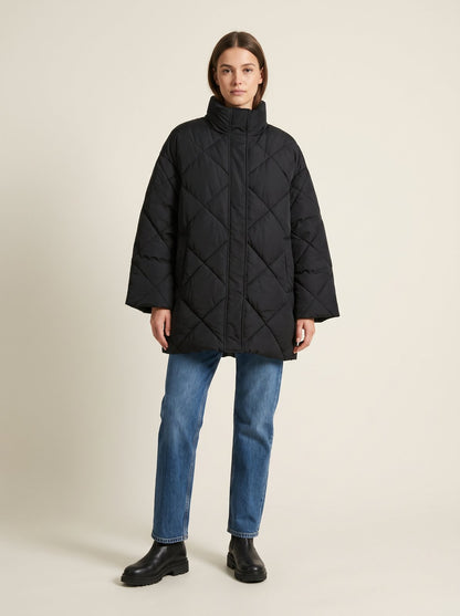Black oversized quilted puffer jacket by Lode Lane