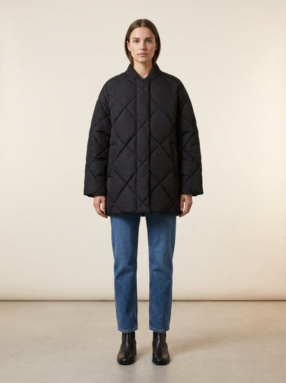 Black oversized quilted puffer jacket by Lode Lane