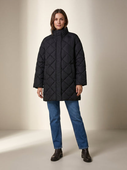 Black oversized quilted puffer jacket by Lode Lane