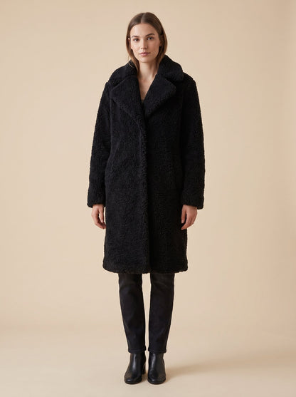 Black faux shearling teddy coat by Lode Lane