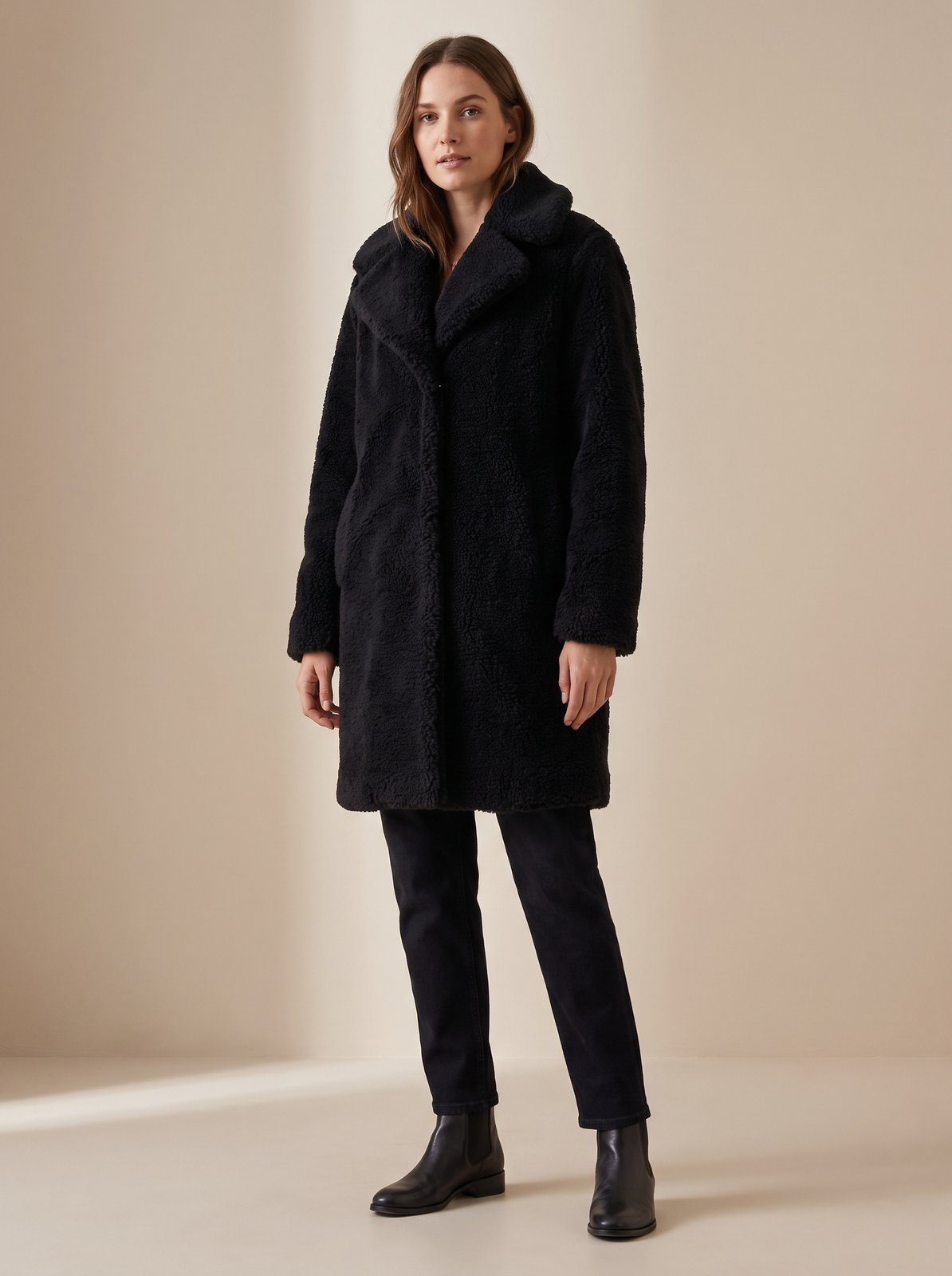 Black faux shearling teddy coat by Lode Lane