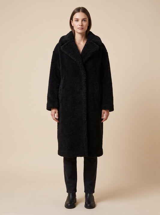Black faux shearling teddy coat by Lode Lane